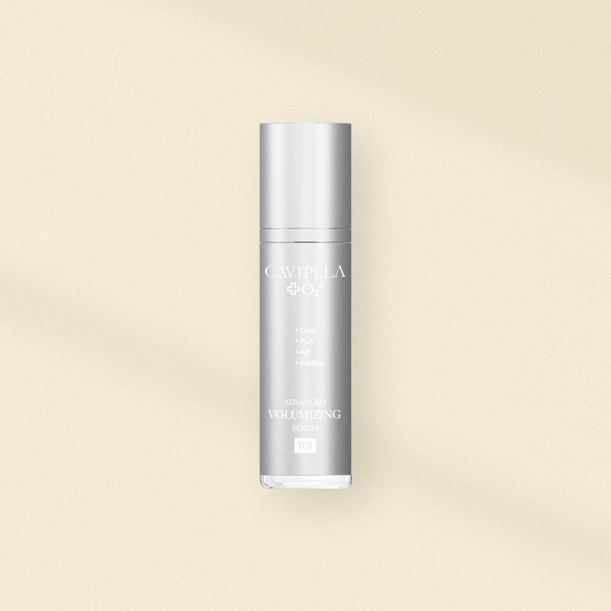 Serums and ampoules: HOP+ CAVIPLLA+O2 Advanced Volumizing Serum bottle on a warm plaster wall